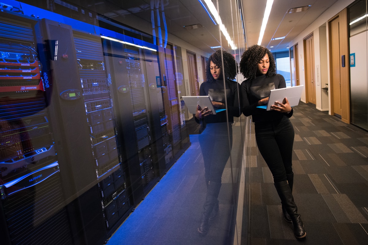 Business professionals reviewing equipment in a server room