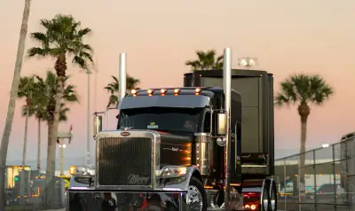 Black Peterbilt conventional-cab semi truck